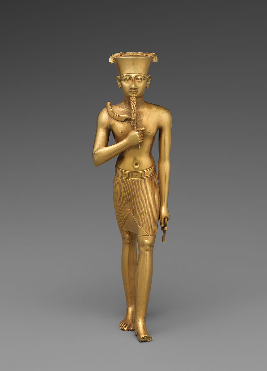 Statuette en or massif du dieu Amon debout, coiffé de sa couronne plate, tenant un ankh